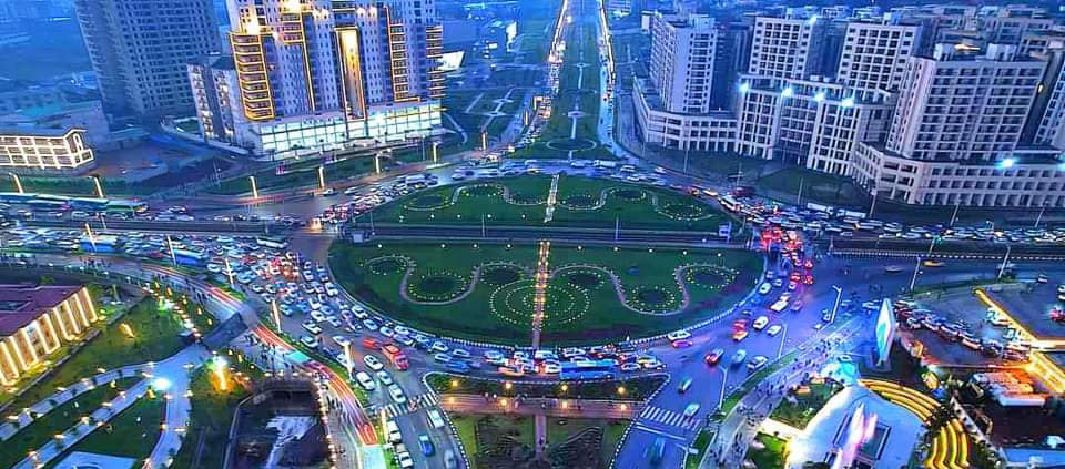 Aerial view of Addis Ababa at night, with lit roads circling a roundabout